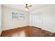 Cozy bedroom with hardwood floors, a window for natural light, and a spacious closet at 1155 Melrose Dr, Rock Hill, SC 29732