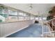 Bright sunroom enclosed with multiple windows and a fan for climate control at 1155 Melrose Dr, Rock Hill, SC 29732
