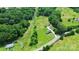 Expansive aerial view of a home surrounded by lush greenery and a well-maintained lawn at 117 Autumn Woods Dr, Kings Mountain, NC 28086