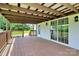 The back deck offers a spacious area for outdoor relaxation with a view of the green backyard at 117 Autumn Woods Dr, Kings Mountain, NC 28086