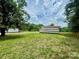 Large backyard featuring a shed, wooden fence, and ample green space at 117 Autumn Woods Dr, Kings Mountain, NC 28086