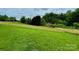 A spacious backyard with a new wooden fence and lush green grass at 117 Autumn Woods Dr, Kings Mountain, NC 28086
