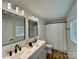 Bright bathroom with double vanity, modern fixtures, and wood-look flooring at 117 Autumn Woods Dr, Kings Mountain, NC 28086