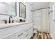 Modern bathroom with double vanity, sleek black fixtures, and a shower-tub combination at 117 Autumn Woods Dr, Kings Mountain, NC 28086