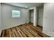 Bright bedroom with hardwood floors, closet, and natural light from the window at 117 Autumn Woods Dr, Kings Mountain, NC 28086