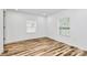 Bright bedroom with modern flooring and two windows providing natural light at 117 Autumn Woods Dr, Kings Mountain, NC 28086