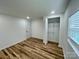 A bedroom with neutral colors, a walk-in closet and hardwood floors at 117 Autumn Woods Dr, Kings Mountain, NC 28086