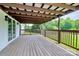 Covered wooden deck featuring a view of the large backyard at 117 Autumn Woods Dr, Kings Mountain, NC 28086
