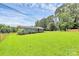 Spacious yard with a charming home featuring gray siding, and well-maintained landscaping at 117 Autumn Woods Dr, Kings Mountain, NC 28086