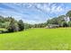 Lush green front yard with well-maintained lawn and a charming fence around the property at 117 Autumn Woods Dr, Kings Mountain, NC 28086