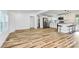 Bright, open-concept kitchen featuring stainless steel appliances, white cabinets, and a breakfast bar at 117 Autumn Woods Dr, Kings Mountain, NC 28086