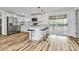 Modern updated kitchen with stainless appliances, a center island with barstool seating, and access to the deck at 117 Autumn Woods Dr, Kings Mountain, NC 28086
