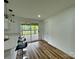 Bright kitchen featuring a breakfast bar, wood floors and a sliding glass door leading to the deck at 117 Autumn Woods Dr, Kings Mountain, NC 28086