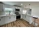 Modern kitchen featuring stainless steel appliances, white cabinets, and a view to the outdoor patio at 117 Autumn Woods Dr, Kings Mountain, NC 28086