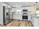 Modern updated kitchen with stainless appliances and white cabinets, offering ample space for cooking and storage at 117 Autumn Woods Dr, Kings Mountain, NC 28086