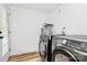 A functional laundry room featuring a modern washer and dryer, a convenient door to the outside at 117 Autumn Woods Dr, Kings Mountain, NC 28086
