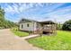 Back of the home with a covered patio and a well manicured lawn at 117 Autumn Woods Dr, Kings Mountain, NC 28086