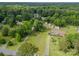 Expansive aerial view of a home on a large, wooded lot, highlighting its peaceful and secluded location at 1188 Rainbow Cir, Catawba, SC 29704