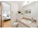 Bathroom featuring a vanity with a sink, toilet, decorative plants, and wall art at 1188 Rainbow Cir, Catawba, SC 29704