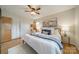 Well-lit bedroom with hardwood floors, neutral decor, ceiling fan, and comfortable furnishings at 1188 Rainbow Cir, Catawba, SC 29704