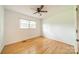 Empty bedroom showcasing hardwood floors, a ceiling fan, and ample natural light at 1188 Rainbow Cir, Catawba, SC 29704