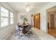 Bright dining room with a round table, seating for four, and natural light from a large window at 1188 Rainbow Cir, Catawba, SC 29704