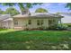 Charming backyard with beautiful garden bed featuring colorful hydrangeas under a bright blue sky at 119 Ashwood Ln, Mooresville, NC 28117