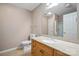 Bathroom features a vanity with a sink, toilet, mirror, and a tiled floor at 119 Ashwood Ln, Mooresville, NC 28117