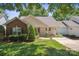 Charming single story home featuring manicured lawn and tidy landscaping in a well-maintained community at 119 Ashwood Ln, Mooresville, NC 28117