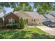 Charming single story home featuring manicured lawn, tidy landscaping, and a truck in the driveway at 119 Ashwood Ln, Mooresville, NC 28117