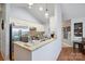 Bright kitchen featuring granite countertops, stainless steel appliances, modern fixtures, and natural light at 119 Ashwood Ln, Mooresville, NC 28117