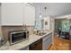 Bright kitchen with granite countertops, stainless steel appliances, two-tone cabinets, modern fixtures, and natural light at 119 Ashwood Ln, Mooresville, NC 28117