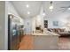 Bright kitchen featuring granite countertops, stainless steel appliances, modern fixtures, and natural light at 119 Ashwood Ln, Mooresville, NC 28117