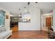 An open floor plan view that leads to a delightful kitchen with stainless steel appliances and a view of the dining room at 119 Ashwood Ln, Mooresville, NC 28117