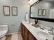 Bathroom featuring double sinks, a large mirror, and modern decor at 1230 Somersby Ln, Matthews, NC 28105