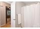 Bathroom featuring neutral walls, and a white shower curtain at 1230 Somersby Ln, Matthews, NC 28105
