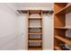Organized walk-in closet with wooden and wire shelving for ample storage space at 1230 Somersby Ln, Matthews, NC 28105