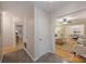 Bright entryway featuring hardwood floors, gray walls, with an open view into the living and dining areas at 1230 Somersby Ln, Matthews, NC 28105