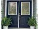 Close up of the front door, featuring black double doors with decorative glass panels at 1230 Somersby Ln, Matthews, NC 28105
