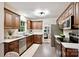Updated kitchen with granite countertops, stainless steel appliances, and seamless flow to the dining area at 1230 Somersby Ln, Matthews, NC 28105
