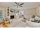 Bright living room with a fireplace and built-in shelving, with neutral decor and hardwood floors at 1230 Somersby Ln, Matthews, NC 28105