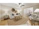Inviting living room with hardwood floors, neutral walls, and an open layout to the dining area at 1230 Somersby Ln, Matthews, NC 28105