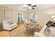 Bright and airy living room with hardwood floors, neutral walls, and ample natural light at 1230 Somersby Ln, Matthews, NC 28105