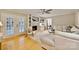 Living room with a fireplace, a ceiling fan, neutral decor and hardwood floors at 1230 Somersby Ln, Matthews, NC 28105