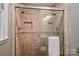 Tiled shower featuring dual shower heads and a built-in niche for storage and decor at 1230 Somersby Ln, Matthews, NC 28105