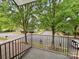 Balcony view of a quiet tree lined street in a residential neighborhood at 12904 Windy Lea Ln, Huntersville, NC 28078