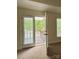 Bedroom view of balcony with black metal railing overlooking a quiet tree lined street at 12904 Windy Lea Ln, Huntersville, NC 28078