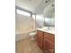 Bathroom features a single sink vanity, toilet and tub-shower combination at 12904 Windy Lea Ln, Huntersville, NC 28078