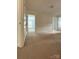 Neutral bedroom featuring carpet flooring, white trim, and several doors at 12904 Windy Lea Ln, Huntersville, NC 28078