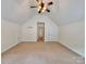 Large bedroom with high vaulted ceiling, ceiling fan, and neutral carpeting at 12904 Windy Lea Ln, Huntersville, NC 28078